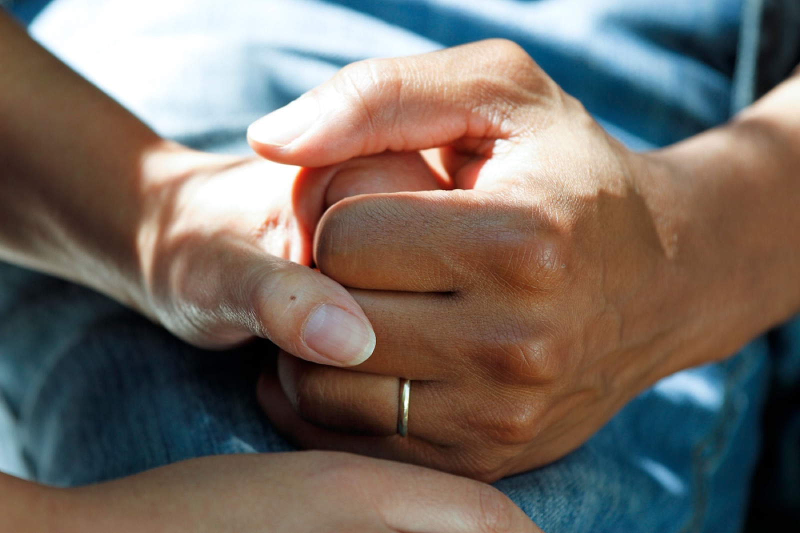 Supportive hands representing patient care and follow-up